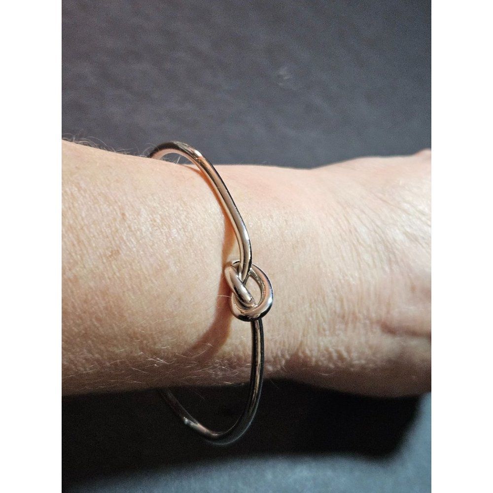Silver tone knotted cuff bracelet 6.5"